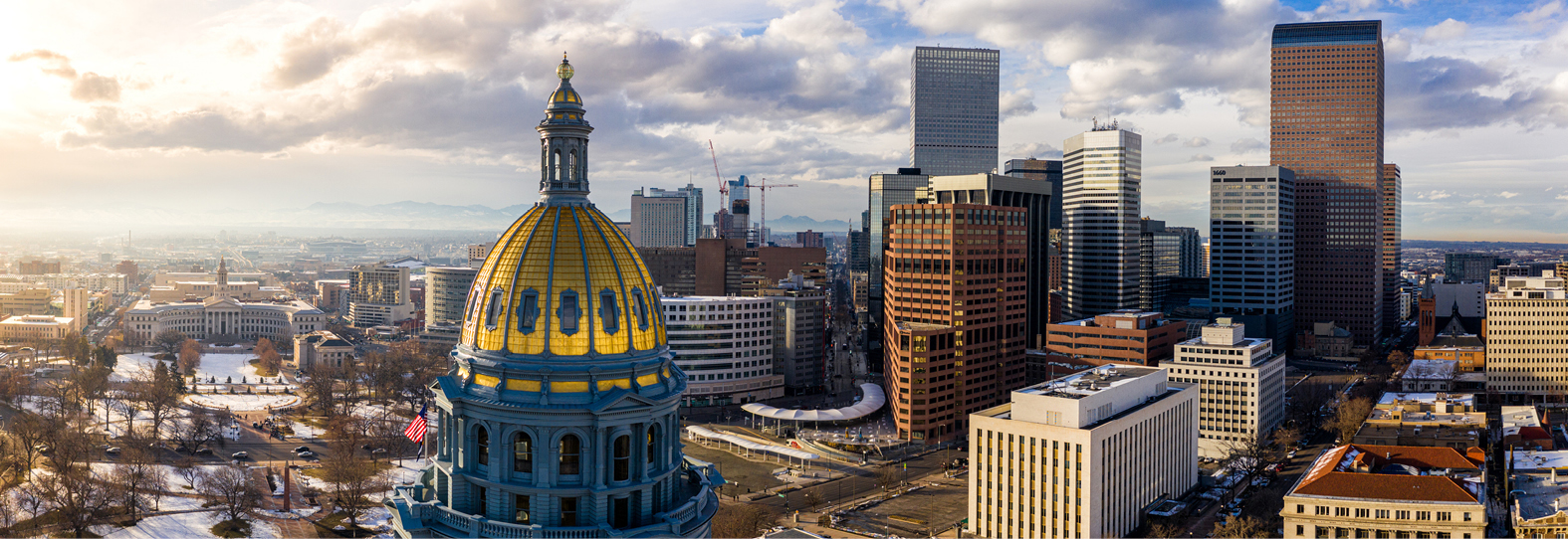 Colorado State Capitol Building and the City of Denver Colorado at Sunset.